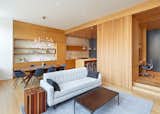 open living / dining / kitchen - a ribbed textured set of sliding doors become movable walls, revealing and concealing the more private areas.
