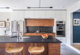 Kitchen, Mosaic Tile Backsplashe, Drop In Sink, and Pendant Lighting  Photo 2 of 9 in Net Zero Row House by Teass \ Warren Architects