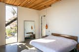 Bedroom, Pendant Lighting, Concrete Floor, and Bed  Photo 9 of 24 in San Clemente Modern by Nate Cole