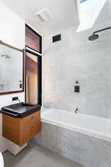 Bath Room, Concrete Counter, Concrete Floor, Marble Wall, and Open Shower  Photo 15 of 24 in San Clemente Modern by Nate Cole