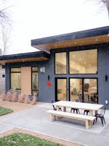 Deep roof overhangs transition into interiors