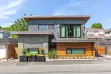 The Dumfries St. laneway house is situated in the rear yard of an existing Vancouver home, between adjacent garages.