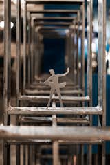 Looking closely into Third Position Café, small sculptures can be seen.  Photo 9 of 10 in “STARSIS” located in Korea designed Third Position Café in which visitors can feel the image of a ballerina. by starsis