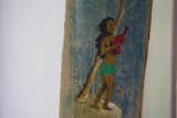 Vintage wood paddle hangs above desk &nbsp;