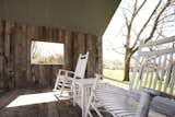 Sitting in the rocking chairs triggers rains to fall from the 'cloud' onto the tin roof