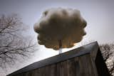 The 'cloud' raining on the tin roof with rain-water collected from a rain storm