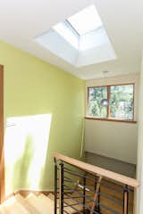white(out) house: an operable Velux skylight at the top of the staircase creates a breeze throughout the house when windows are open.