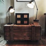 Lamps and an old create make for a stunning living room piece.