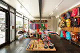 The expansive interior space is brightly lit and organizes Topo's array of adventurous product offerings.