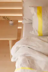 Beautiful linens with sharp punctuations of color brighten the space and make it both comfortable, relaxing, and energizing.