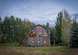 Exterior, Gambrel RoofLine, Cabin Building Type, Wood Siding Material, and Shingles Roof Material  Golden Eagle Log & Timber Homes’s Saves from A Guest Barn in Jackson, Wyoming, Fuses Modern and Rustic Elements
