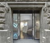 The entrance to X Bank showcases modern works of Dutch art and design which contrast the concrete exterior.