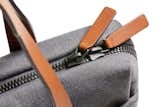 See the beautiful leather-trimmed detail on the Slim Work Tote (shown here in Mid Grey).

https://bellroy.com/products/slim-work-tote/woven/mid_grey