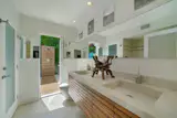Master bathroom with adjacent outdoor shower.