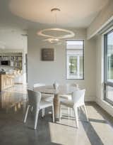 Dining Room, Table, Chair, Accent Lighting, and Concrete Floor Breakfast room  Photo 16 of 25 in Long Island Sound House by Sellars Lathrop Architects