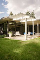 Deep covered rear patio for protecting the house from the western sun in Colorado.  Partial trellis to let some filtered light in. Krisana Park, Denver, CO Cadence Design Studio