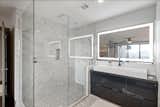 Bath Room, Engineered Quartz Counter, Porcelain Tile Floor, Marble Floor, Ceiling Lighting, Corner Shower, Recessed Lighting, Porcelain Tile Wall, Open Shower, One Piece Toilet, and Vessel Sink Master Shower and Vanity  Photo 6 of 40 in The Modern Renovation in Phoenix by Mitch Steidl