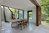 Dining room opens to courtyard. House on a Stream by Architecture BRIO. © Sebastian Zachariah.

upinteriors.com/go/sph413