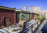The brownstones feature street level front stoops, rooftop patios with river and skyline views and 2-car attached garages.