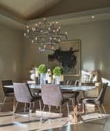 Seductive lighting creates ambiance around a Formworks marble-topped dining table. McGuire dining chairs are comfortable enough to spend an entire evening.  Photo 3 of 12 in A New Beginning by Nancy Van Natta Associates