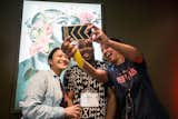 TEDxNewYork 2016 attendees grabbing a selfie between sessions with speaker Mark S. Luckie