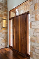 This is our Pola pivot door with glass transom and sidelights. All of our standard door models come with 10 options for customization and instant pricing! Check them out at http://www.pivotdoorcompany.com/Exterior-Doors/.