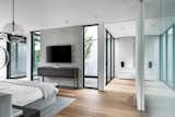 Bedroom, Dresser, Bed, Night Stands, Recessed Lighting, Concrete Floor, and Light Hardwood Floor Courtyard Views.  Photo 7 of 12 in Miami Modern by smpl Design Studio