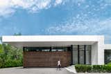 Exterior, Flat RoofLine, Concrete Siding Material, Metal Siding Material, Glass Siding Material, and House Building Type Concealed garage doors.  Photo 4 of 12 in Miami Modern by smpl Design Studio