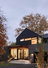 standing seam metal roofing and siding, along with brick and accent corten work harmoniously on this home
