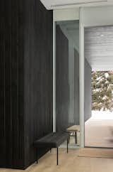 shou sugi ban charred wood siding blending from the outside to inside environment