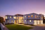 Exterior, Stone Siding Material, Glass Siding Material, House Building Type, Wood Siding Material, Green Roof Material, Flat RoofLine, Metal Siding Material, and Metal Roof Material Twilight glow.   Photo 4 of 17 in Xanadu by Spaces CT