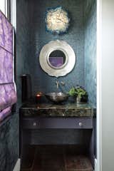 The formal powder room. Laborite countertop and glass vessel sink. 