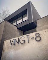 Exterior, House Building Type, Flat RoofLine, Metal Siding Material, Brick Siding Material, and Concrete Siding Material Address by MODERN ADDRESS NUMBERS  Search “numbers” from The "Vingt-8" house