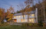Exterior, House Building Type, Farmhouse Building Type, Metal Roof Material, Gable RoofLine, and Wood Siding Material  Photo 3 of 25 in 20 Modern Farmhouse Design Ideas That Are Irresistibly Chic from Vermont Residence