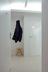 Entrance with storage niche and stool.  Photo 11 of 27 in Rhapsody in White  / Attic by AT26  architects