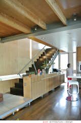 The credenza by the kitchen and dining area also guards the open staircase against accidental falls.