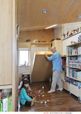 Murphy beds give the kids more play space during the day.