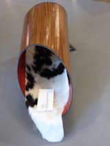 Cat Cannoli by architect David Cole, founder and principal of Inclusion Studio. Low and cozy, the cannoli features a walnut veneer exterior that brings to mind a mid-century modern houses. A real, cat-sized cowhide rug slips inside the bright red interior. 