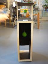 Vertical Modern Cat Tower by artist and interior designer Clark Hipolito, founder and principal of The Art Co. Created with a cat’s love of climbing in mind, the tall Tower features lots of scratching surfaces and a very “climbable” structure.  A couple of dangling green balls for batting around complete the contemporary composition. 