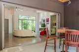 A folding glass door system opens the house to the back porch and extends the living space.