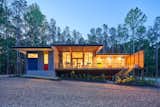 The southern porch at twilight.  Photo 7 of 11 in The Privacy House by Arielle Condoret Schechter, AIA: Simple, Modern, Net Zero by Kim Weiss