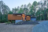 The street view at twilight.  Photo 9 of 11 in The Privacy House by Arielle Condoret Schechter, AIA: Simple, Modern, Net Zero by Kim Weiss