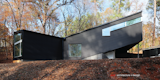 Viewed from the creek, the fenestration marks interior volumes. L-R: The main Living volume; the middle Working volume; and the Sleeping volume.