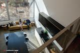 Looking down into the kitchen/dining/living space. Natural light fills the space through the huge window.