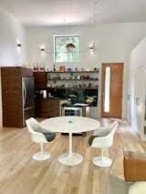 Dining Room, Recessed Lighting, Chair, Light Hardwood Floor, and Table Inside the front door, the compact kitchen and dining space.  Photo 7 of 16 in The Tadpole, aka The Jewel Box by Kim Weiss