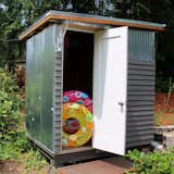 The shed stores lake toys and was created from 90% recycled materials and is powered by a micro solar setup.