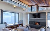 Stuv fireplace and window seat with an up mountain view.