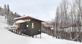 Exterior, Wood Siding Material, Metal Roof Material, House Building Type, Shed RoofLine, and Cabin Building Type View of chalet from entry drive.  Photo 1 of 1 in Modern Getaways by Mark Neely from Laurentian Ski Chalet