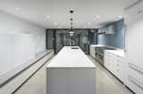 Sleek white kitchen with Heath tile backsplash
