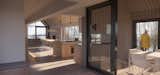 Arrival hall and view of the screened porch, kitchen, and living room (beyond)